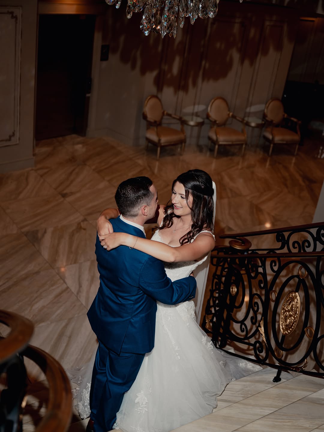 Couple dancing at night by the grand staircase