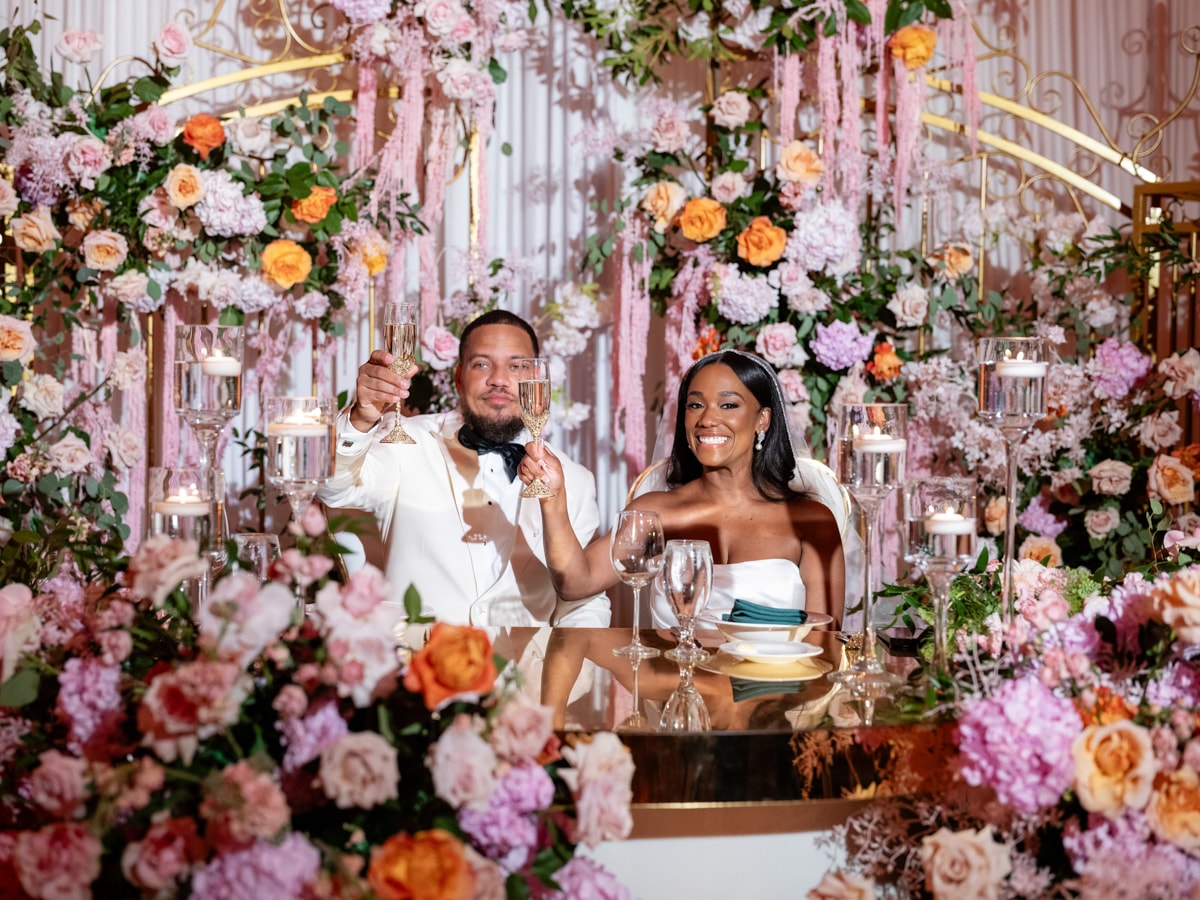 A toast before the floral wall