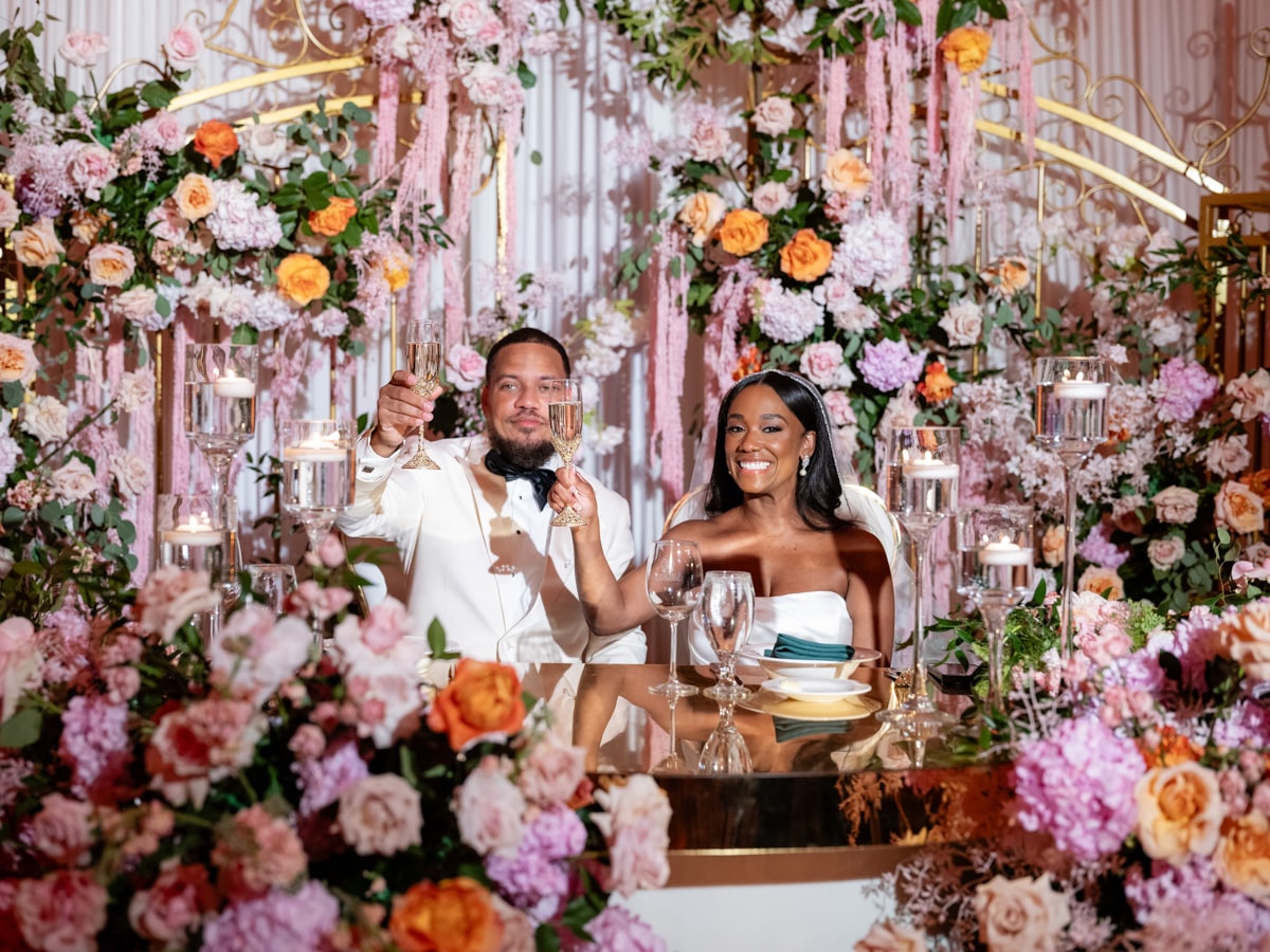 A toast before the floral wall